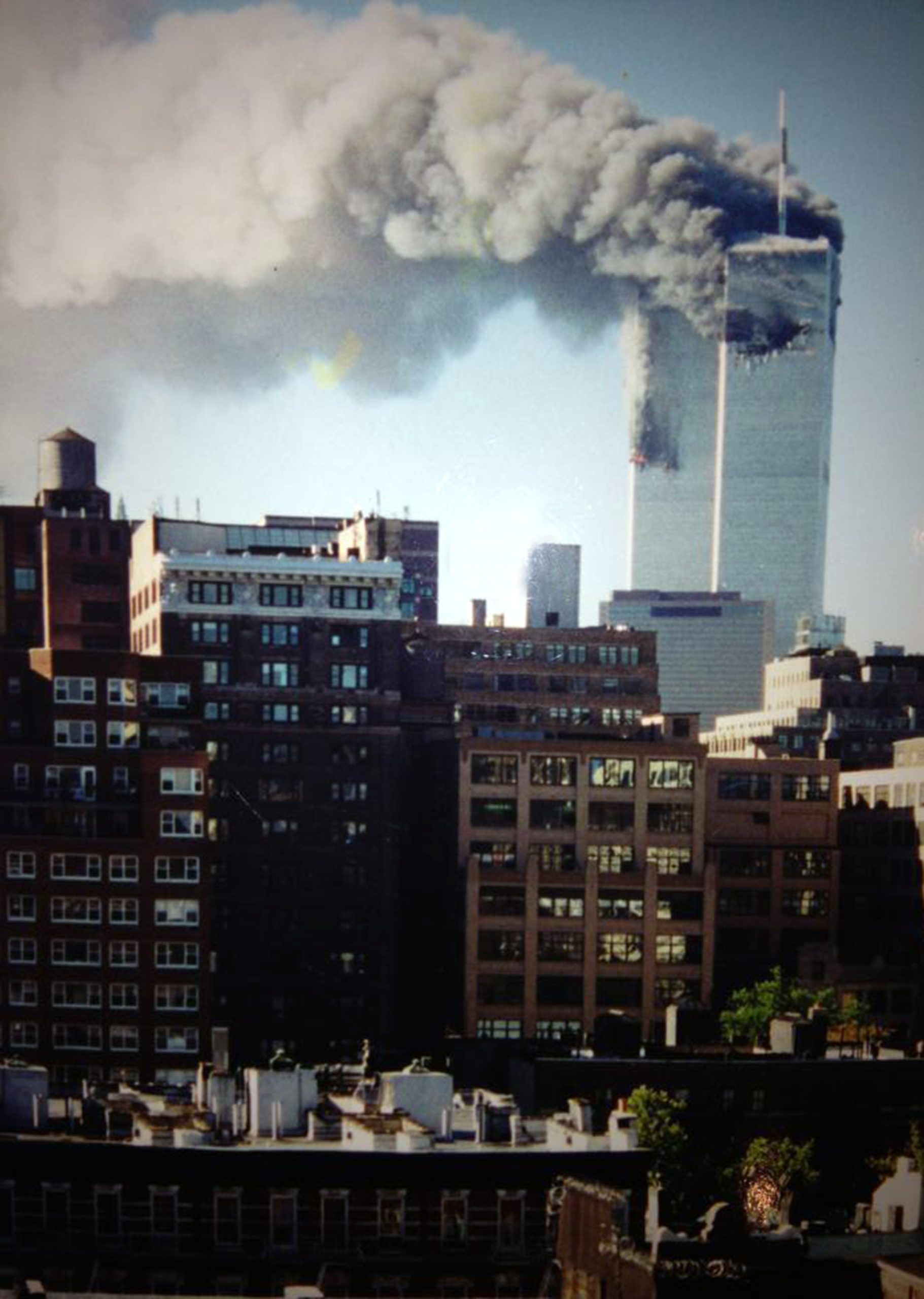 Image of the world trade center towers burning on 9/11