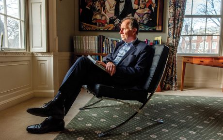 Image of Professor Dietrich Neumann sitting in a Mies-designed “Barcelona” chair