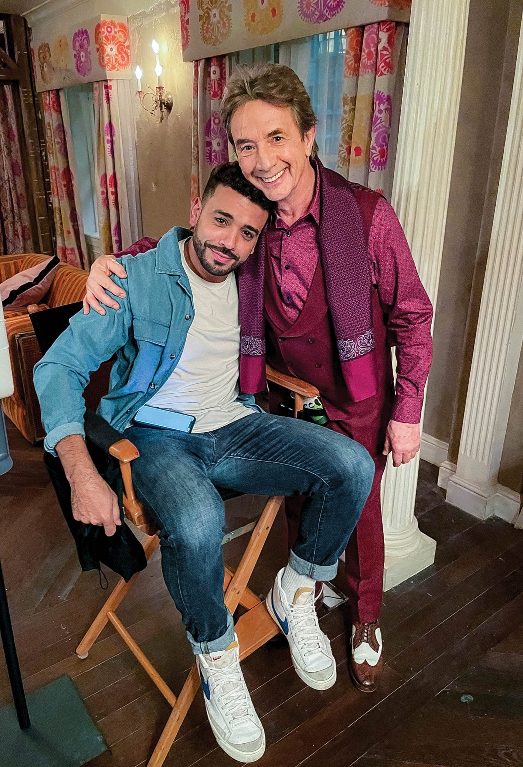 Image of Ryan Broussard on set with Martin Short on set for season two of 
