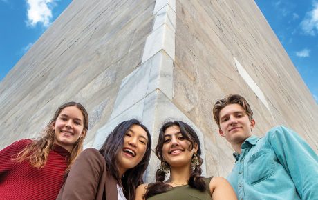 Image of Isabelle Sharon ’23.5, Alice Im ’24, Ruhma Khawaja ’24, and author Peder Schaefer ’22.5 at the base of the Washington Monument.
