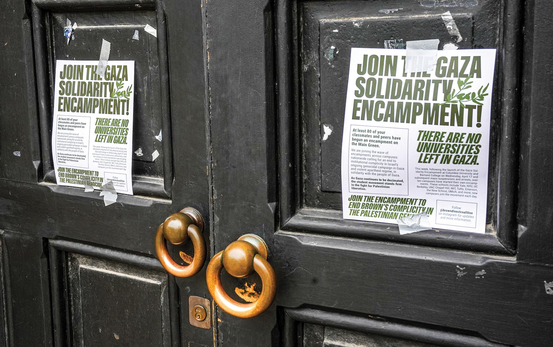 Image of doors that have signs posted declaring 