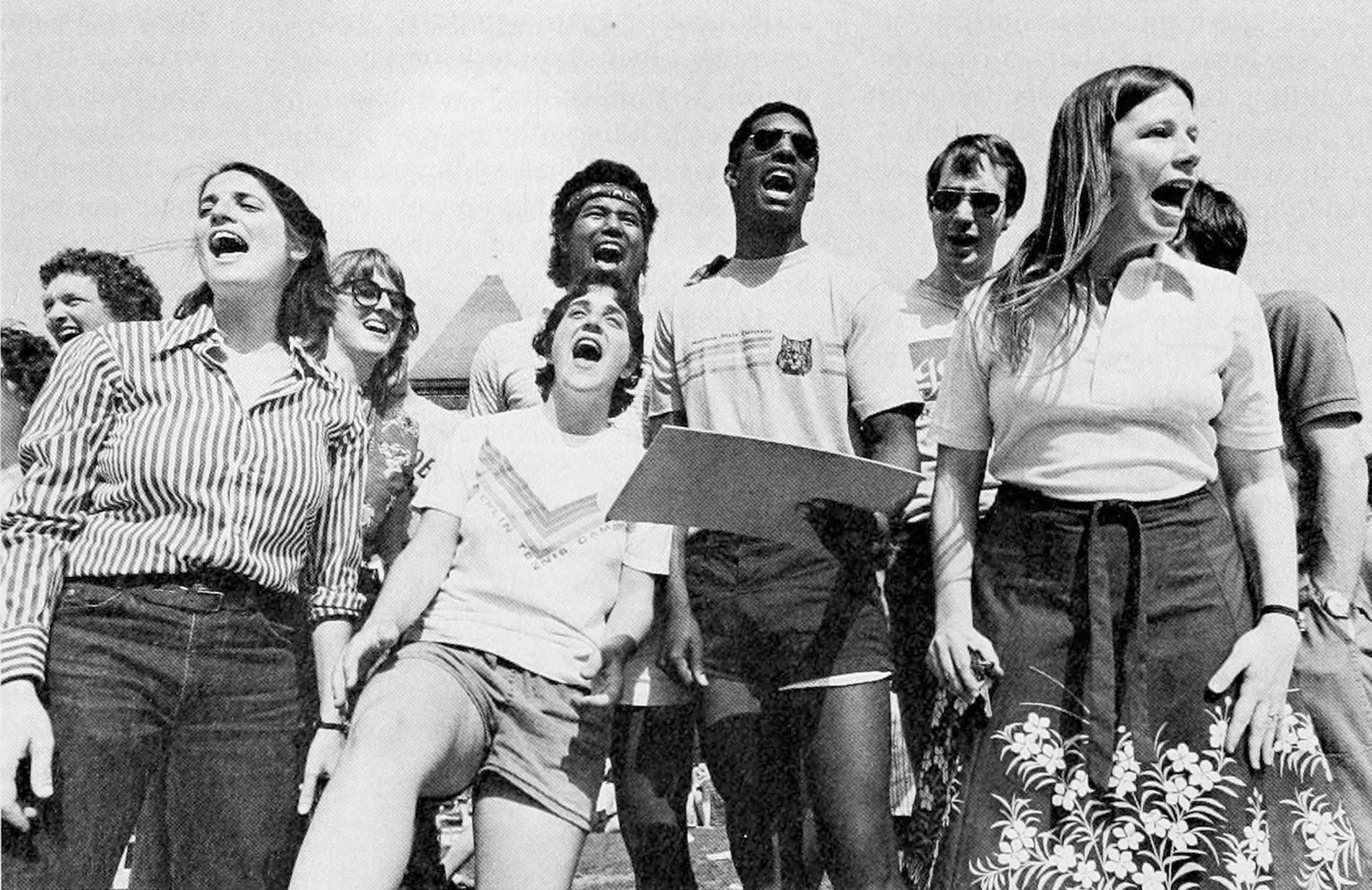 An archival image of students calling Twister directions on the Main Green.