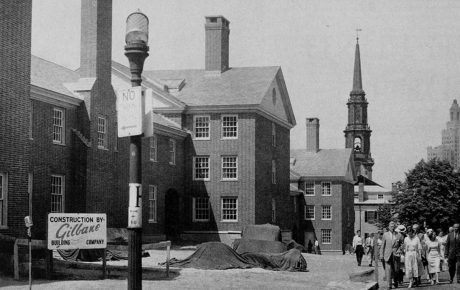 Archival image of Kenney Quad with onlookers in 1957.