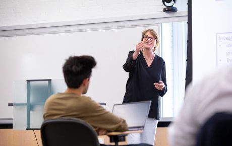 Christina Paxson in front of a classroom.