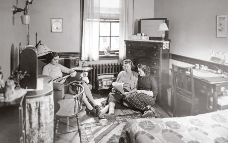 Archival image of women in a dorm room in Pembroke