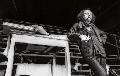 Archival image of Richard Foreman leaning on stage
