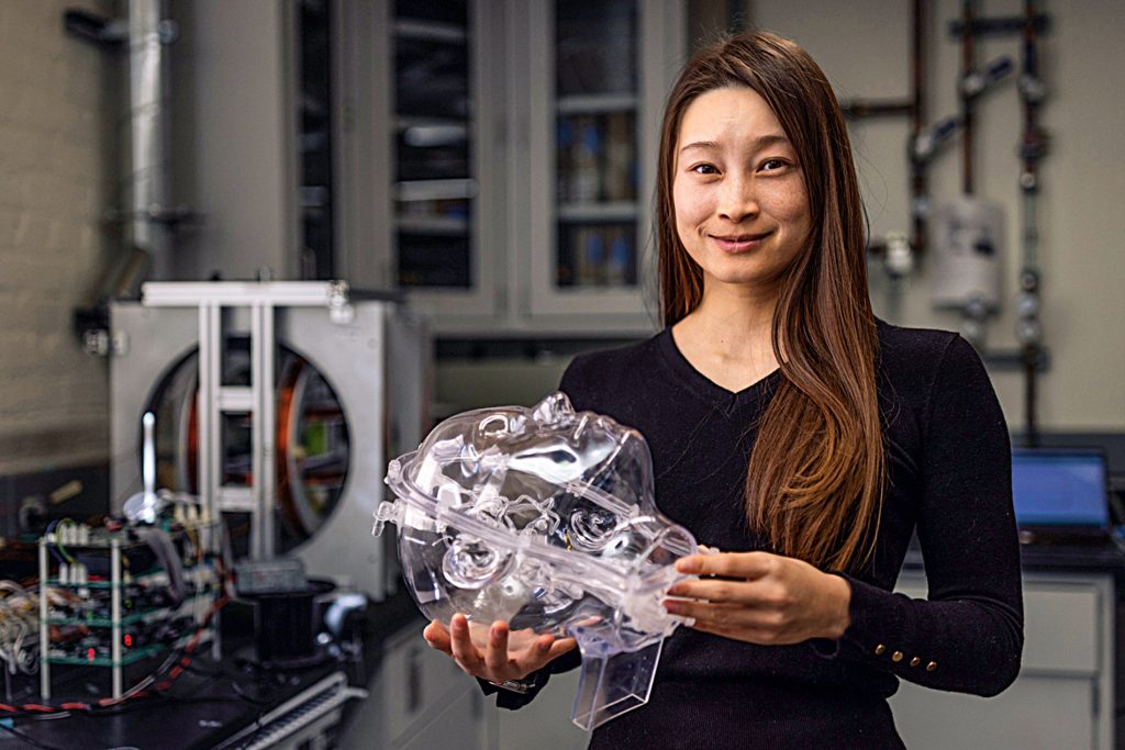 Renee Zhao holding a scientific tool