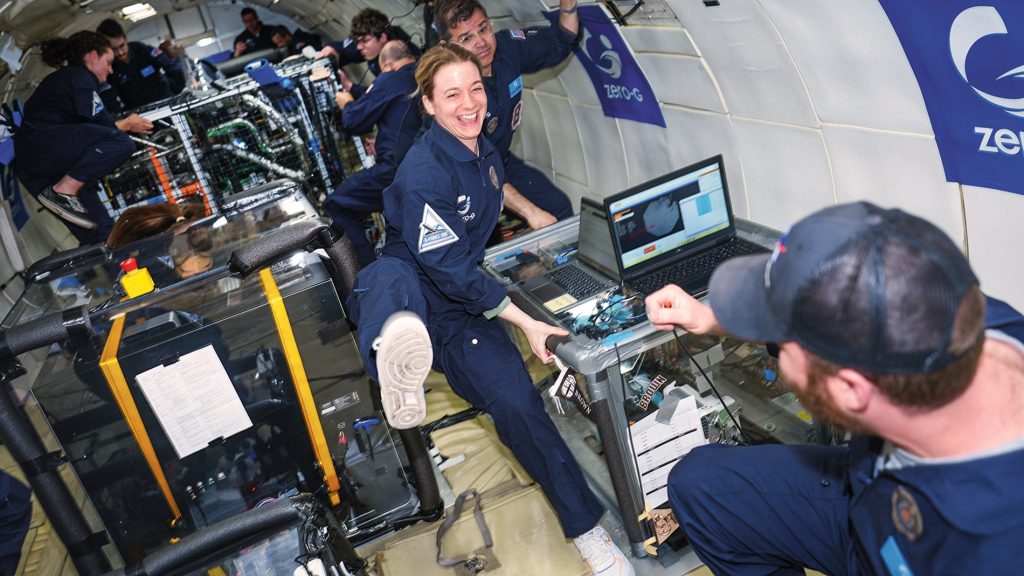 Student floating in zero gravity